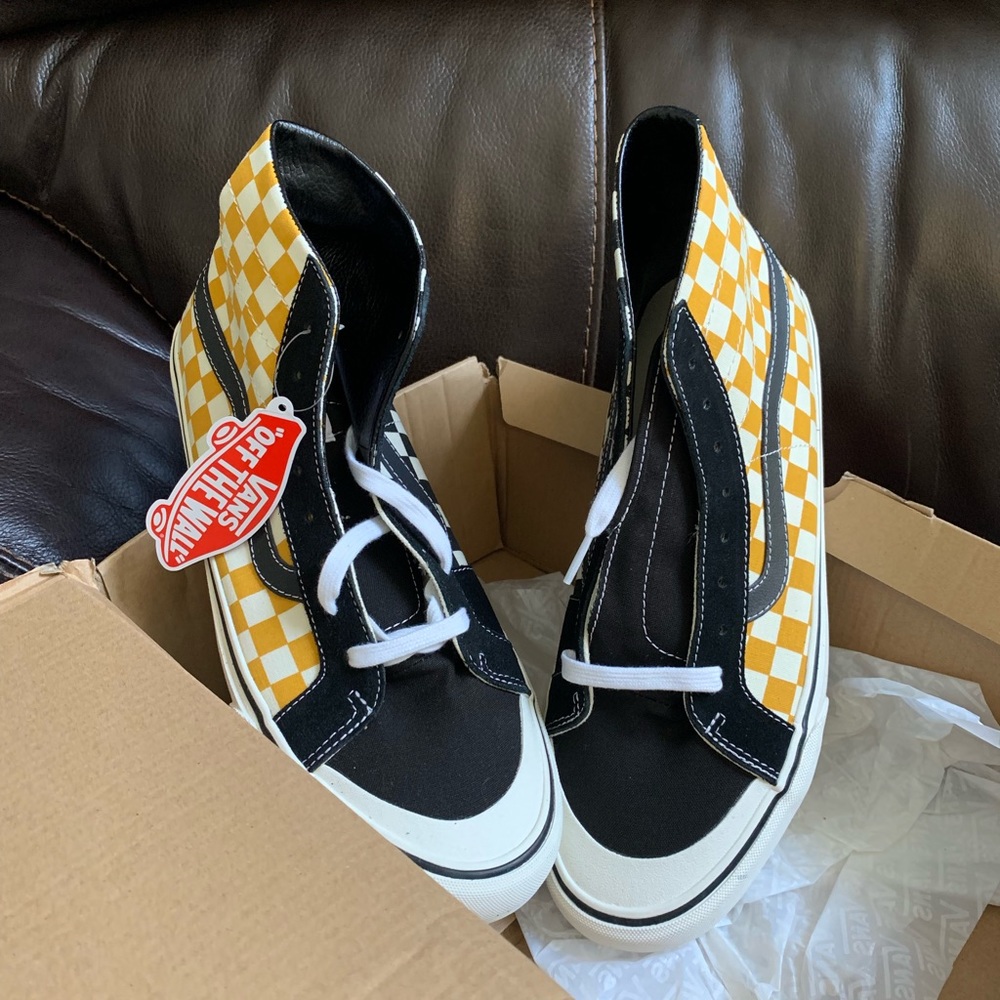 Vans black and gold checkered high tops
